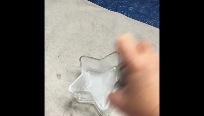 Apply a thin coat of bonding primer to the glass container. Ensure proper ventilation and wear a mask and glasses.