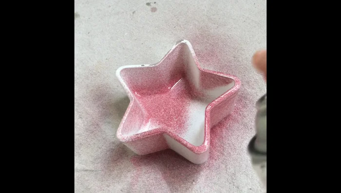 Apply a coat of red glitter spray paint to the inside of the container. The inside adheres better than the outside.