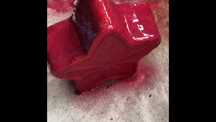 Touch up any areas that need additional paint or glitter.