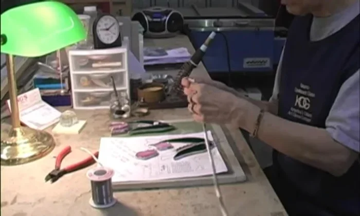 Grind off the rough edges of the glass pieces.