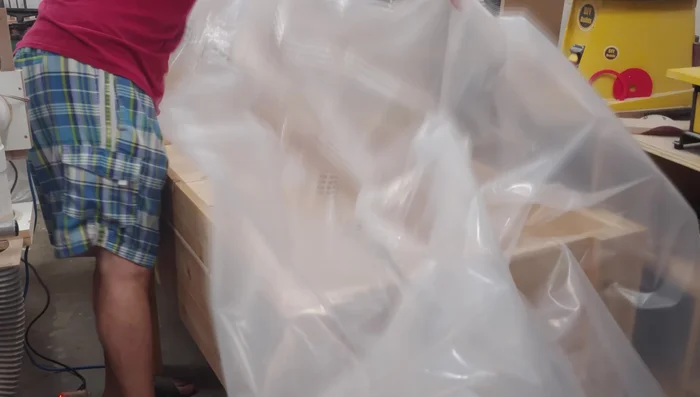 Install the poly vapor barrier using a staple gun (allowing for drainage holes later).