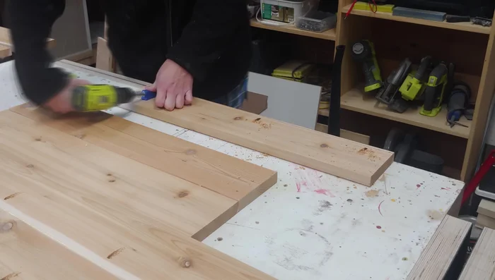 Assemble the short sides to the long sides using glue and pocket holes. Use a vise to flatten any bowing during glue drying.