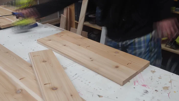 Assemble the short sides to the long sides using glue and pocket holes. Use a vise to flatten any bowing during glue drying.