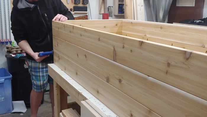 Assemble the box: align long and short sides, clamp, and drill/drive six 3-inch screws into each corner.