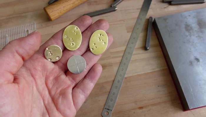 Punch holes in the discs using hole punching pliers.
