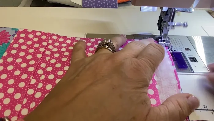 Finish the Bottom: Press the bottom edge up half an inch and stitch to close the opening.