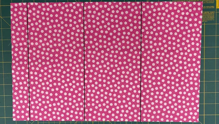 Mark the Fabric: On the front piece, mark one inch up from the bottom, then five inches up, and five inches again. Use a friction pen or marker that disappears with heat or a washable marker.