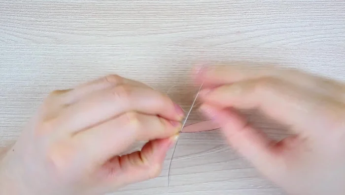 Embroider the edges of the organza wings with size 15 seed beads.