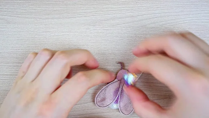 Glue and sew the crystal to the felt.