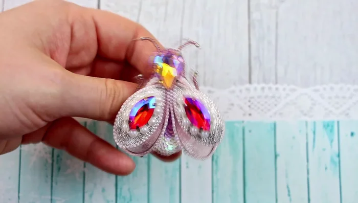 Embroider the edges of the leatherette backing with size 15 seed beads.