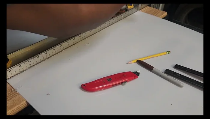 Adding Backing: Attaching back panel to cabinet using previously used material.