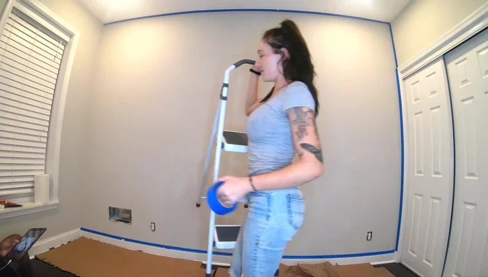 Apply painter's tape to the wall perimeter.