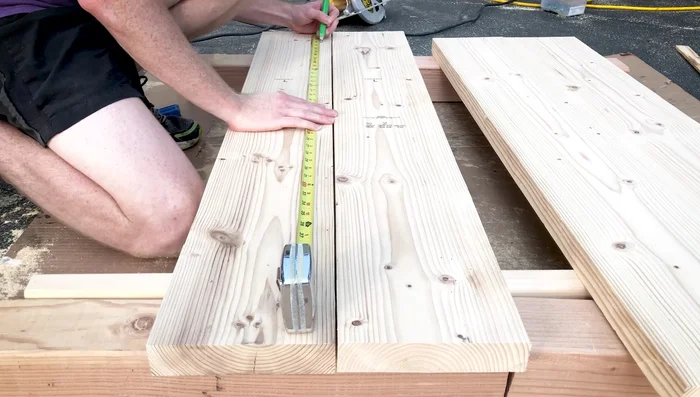 Join table top boards: Use a pocket hole jig to attach the table top boards, spacing pocket holes approximately 12 inches apart. Apply wood glue to strengthen the joint.