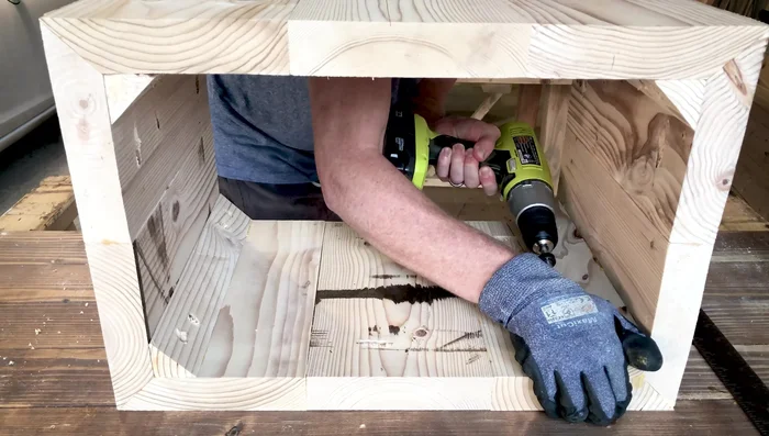 Drill pocket holes for plinth-top connection: Drill pocket holes at the top of the plinth to connect it to the table top.