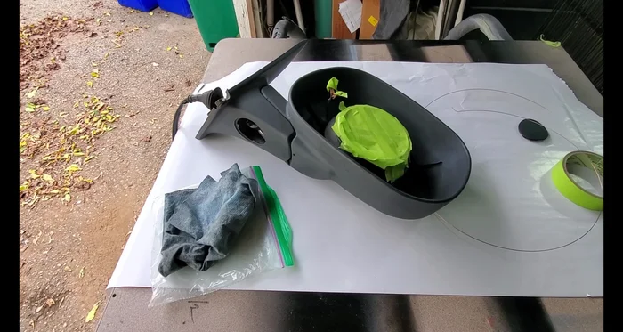 Apply several light coats of primer, allowing each coat to dry before applying the next. Because the weather is cool, it's recommended to bring the part inside to warm up and dry.