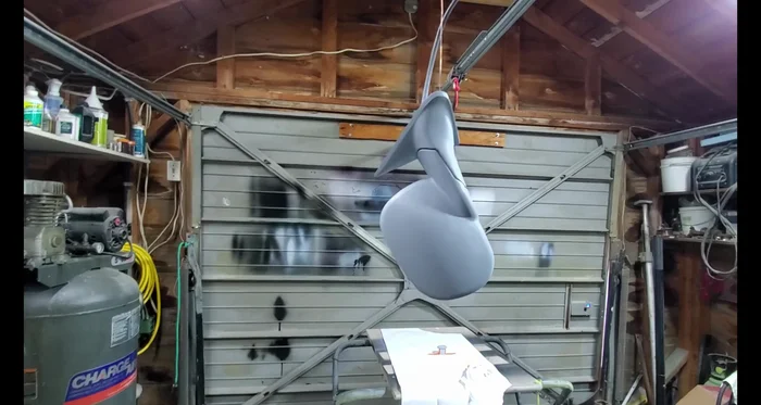 Apply multiple light coats of base coat paint (gloss black in this case).