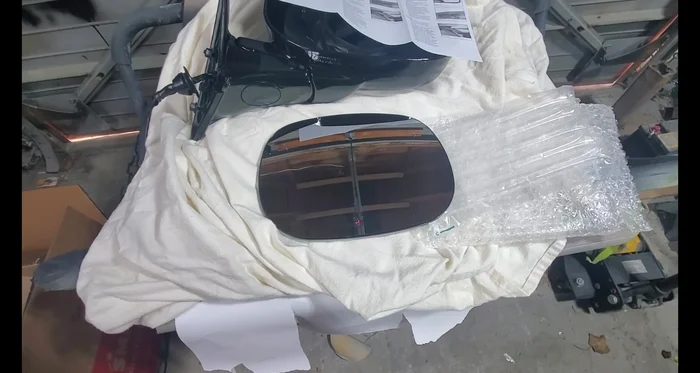 Install the new mirror glass. Follow the instructions provided with the replacement glass.