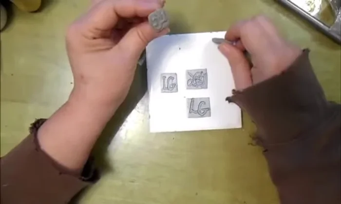 Bake the stamped clay again.