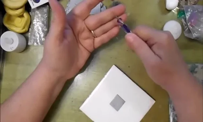 Using the ball-ended tool (larger end), indent your design into the clay. Press firmly to create a deep impression.