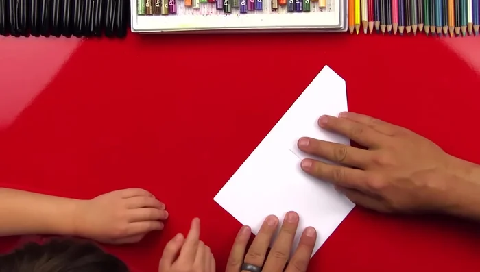 Fold the top flaps down along the center crease.