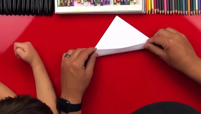 Fold the top edge up to match the other side.