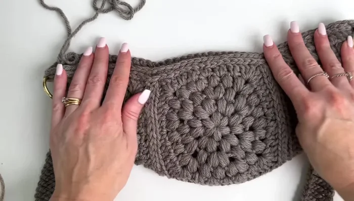 Optionally, sew down the loose ends of the crocheted zipper to keep them neat and tidy.