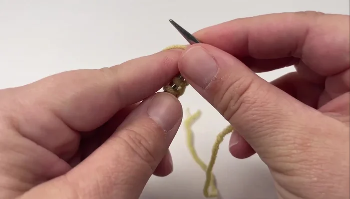 Slip the last stitch purlwise with the yarn in front.