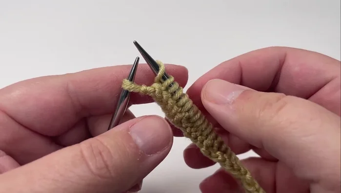 Slip the last stitch purlwise with the yarn in front.