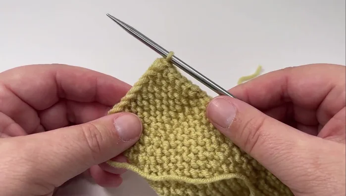 Cut the yarn, leaving a tail, and pull it through the final loop. Sew in ends.