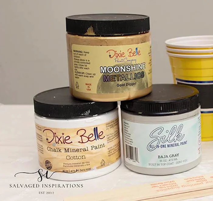 Gather supplies: Have paints, Floetrol, cups, stir sticks, gloves, and a protected work surface ready.