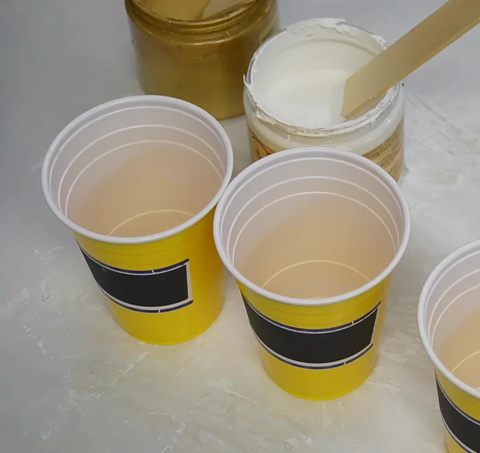 Mix paints: Create a 50/50 mix of paint and Floetrol in separate cups for each color. This ensures a good flow for pouring.