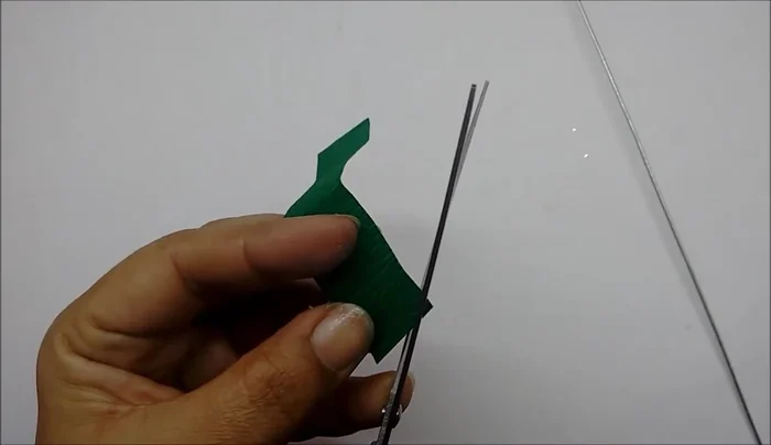 Glue and wrap the sepals around the base of the flower, starting from the bottom and going up.