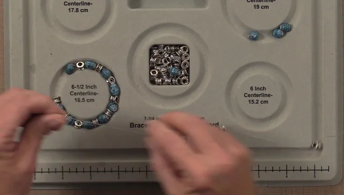 String your beads onto stretch cord, alternating with spacer beads, using your chosen bracelet size as a guide. Tie off the ends with multiple knots and secure with superglue.