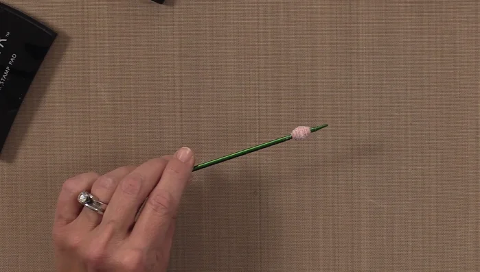 Heat the embossing powder with a heat tool to melt and create a shiny, durable finish. You can repeat steps 6 & 7 for an extra shiny coat.