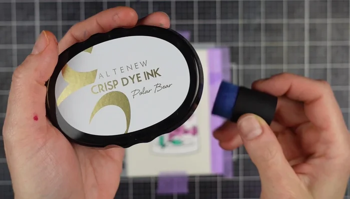 Spray iridescent shimmer ink onto the masked vase for a glassy effect.