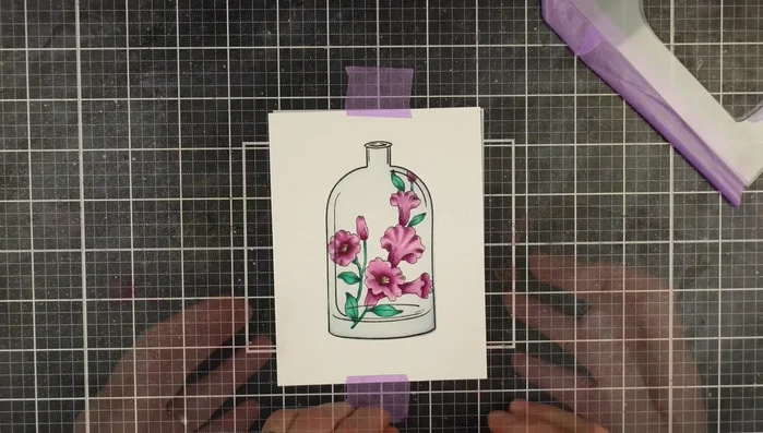 Spray iridescent shimmer ink onto the masked vase for a glassy effect.