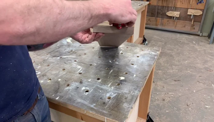 Prepare the board: Mark lines 1/4 inch from the top and 3/8 inch from the end. Mark another line 1/4 inch from the 3/8 inch line.