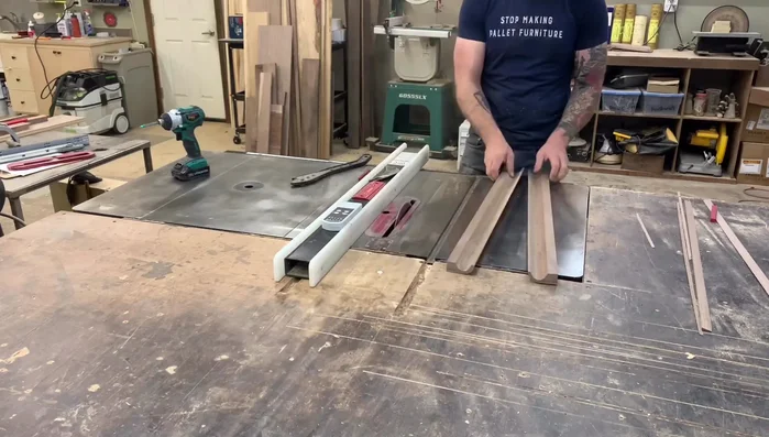 Cut the drawer pulls: Cut the board in half. Mark distances from the back flat portion to the curve start point and mark the same measurement on the opposite side. Connect the marks with a line.