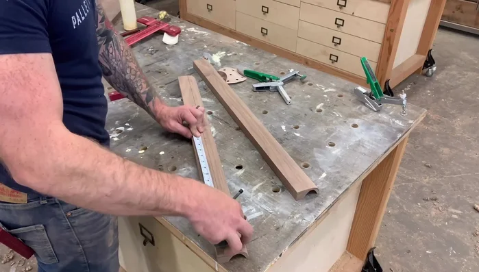 Mark and cut handles: Find the center. Mark the desired handle location (e.g., 3 inches from the center). Use a sanding disc or similar template to draw the handle shape. Cut on the table saw and bandsaw, taking care not to remove too much material.