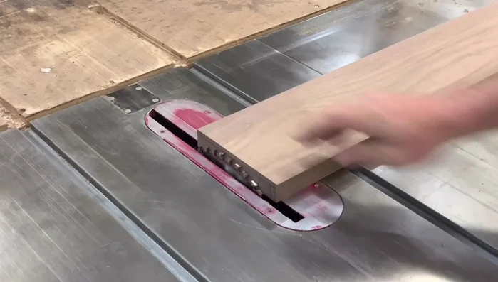 Cut the cove: Set the auxiliary fence at 15 degrees using a template cut from plywood on the chop saw. Ensure the end of the cut is exactly 3/8 inch from the fence. Make multiple shallow passes, raising the blade slightly after each pass. Repeat on the other side.