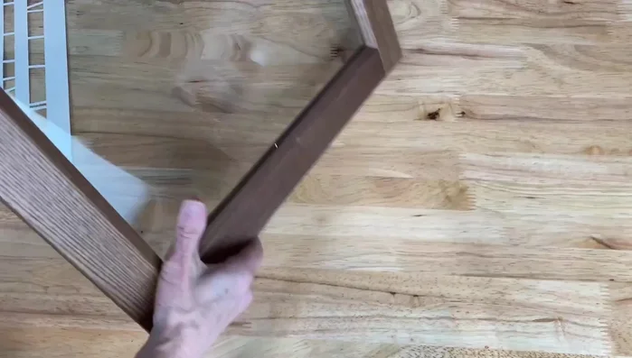 Prepare the surface: Flip the cabinet door over to the back side.