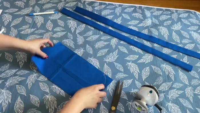 Attach the pocket to the main body: Place the pocket on the main body, aligning the top edges. Sew.