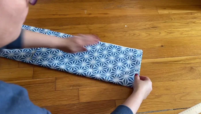 Attach the handles: Fold the straps in half, mark the center, and attach to the top of the bag, leaving a 2-3 inch gap for turning.