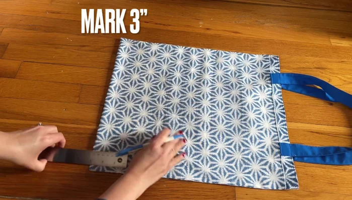 Fold and stitch the bottom of the bag for a clean finish. 