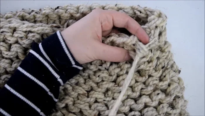 Repeat steps 3 and 4 along the entire top and bottom edges, creating a continuous seam.