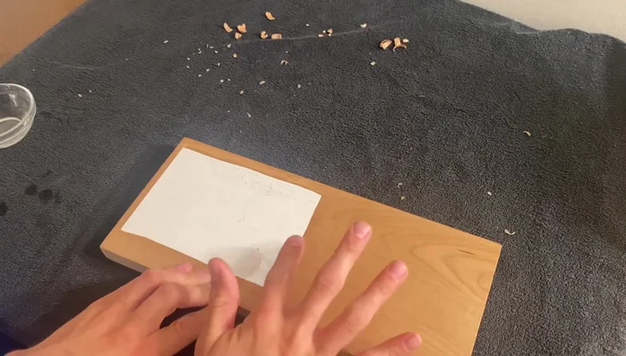 Gently peel the paper away, dampening your fingers to help release the paper. Work slowly and carefully to avoid tearing the paper.