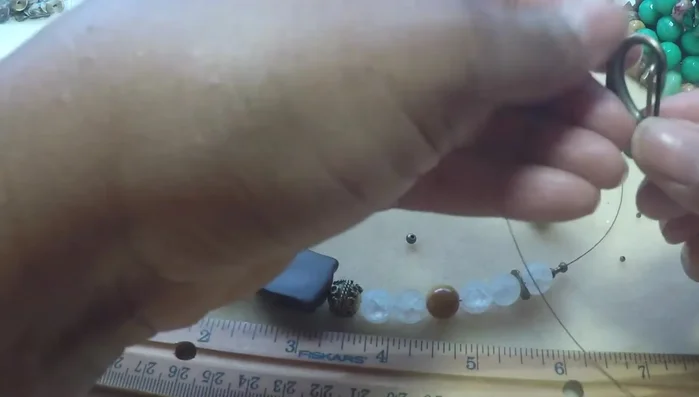 Continue threading the wire through the beads until you reach the middle.