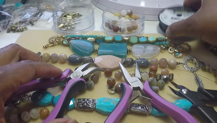 Prepare your materials: nipper tools, soft flex fine wire, chain nose pliers, bent nose pliers, crimp beads, crimping tool, clasp, seed beads, and beads for the bracelet.