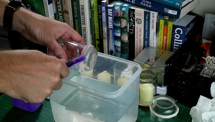 Carefully lower the jar into a bucket of cold water, rotating gently while the string burns through.