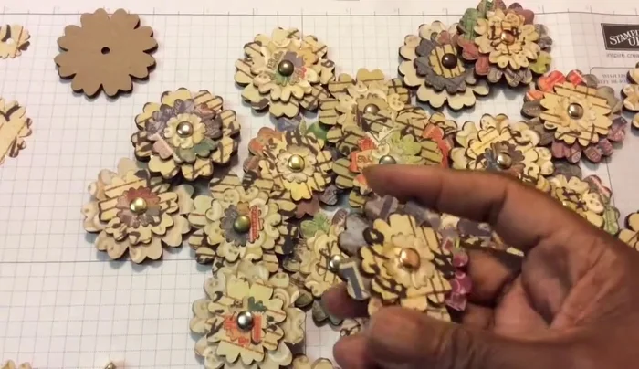 Prepare three layers of different sizes for each flower: a large cardboard layer, a medium chipboard layer, and a small paper layer.